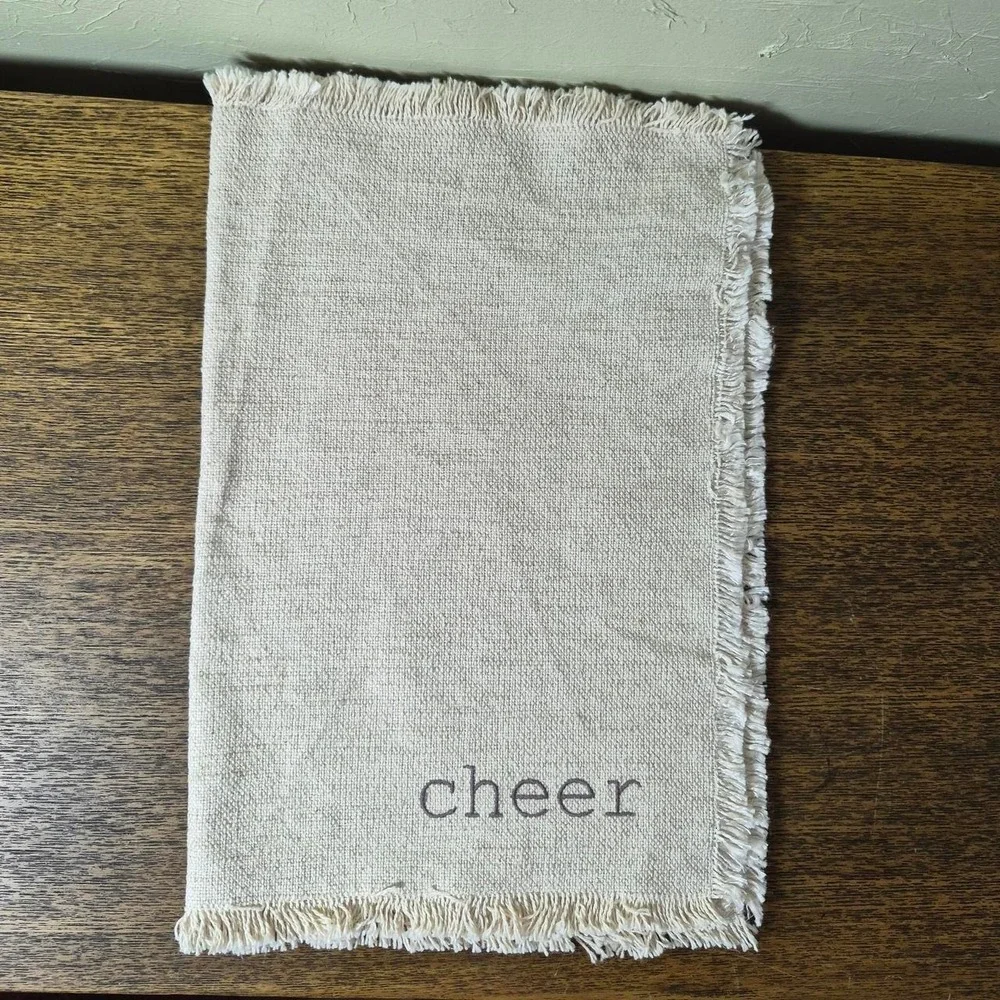 Cream Holiday Placemats (three total) - with the words 'jingle, jolly, & cheer'